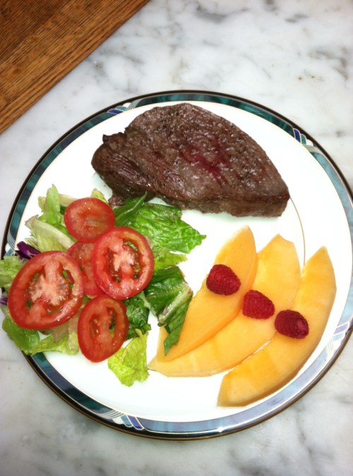 Sirloin steak, salad, cantaloupe, 3 raspberries