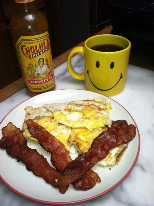 Bacon, eggs, black coffee, and Cholula hot sauce. A caveman wouldn't recognized any of this except for eggs.